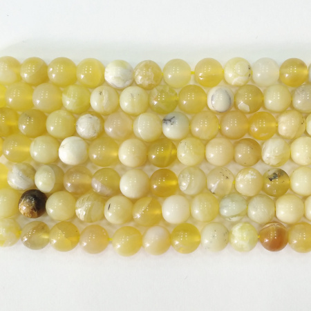 <p>Круглые каменные бусины из натурального желтого опала. Бусины могут немного отличаться по форме и размеру. На бусинах возможны небольшие щербинки естественного происхождения. Оттенок может немного отличаться от фотографии. Цена за низку (около 16 бусин, низки формируются без проверки каждой бусины на дефекты и без подбора по цвету и рисунку).</p>