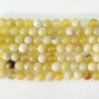 <p>Круглые каменные бусины из натурального желтого опала. Бусины могут немного отличаться по форме и размеру. На бусинах возможны небольшие щербинки естественного происхождения. Оттенок может немного отличаться от фотографии. Цена за низку (около 16 бусин, низки формируются без проверки каждой бусины на дефекты и без подбора по цвету и рисунку).</p>