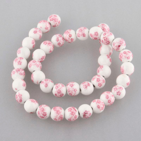 <p>Фарфоровая бусина (porcelain) с сиренево-розовыми цветами (печатный узор), оттенок может отличаться от фотографии. Рисунок может быть немного смазан (см. фото). Диаметр бусин - около 8 мм, диаметр отверстия - около 1.8 мм. Бусины могут немного отличаться по форме и размеру. Цена за низку, около 42 бусин.</p>