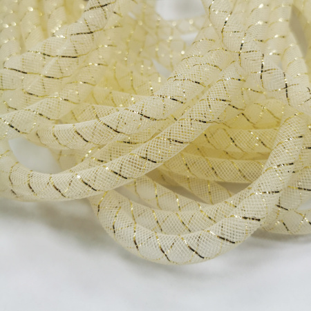<p>
Бижутерная сетка-рукав, сплетена из пластиковых кремовых (бледно-желтых) и золотистых нитей. Оттенок может отличаться от фотографии. Толщина может отличаться от заявленной на +-1.5 мм. Сетку можно наполнить бисером или бусинами, надеть на неё сверху бусины или подвески с не очень маленьким отверстием, завязать в нужном месте узелком. По возможности, продается цельным куском, однако, может поставляться несколькими отрезами. Цена за 10 метров.
</p>
