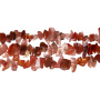 <p>Низка бусин из натурального оранжево-красного сердолика (карнеола, карнелиана). Бусины - сколы неправильной формы. В низке около 260 бусин. Бусины отличаются по форме и размеру. Цена за одинарную низку 85 см.</p>