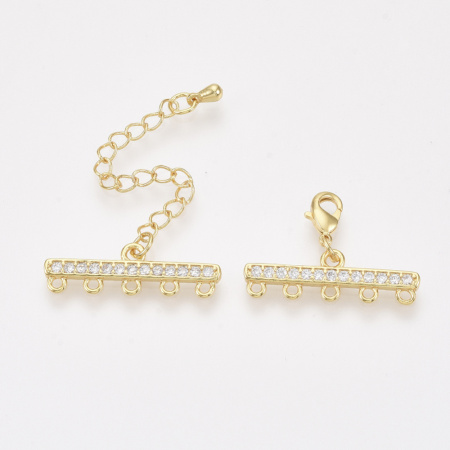 <p>Элитная ювелирная фурнитура премиум класса - Милано люкс (Milano Lux), качественный элемент для создания бижутерии. Набор для окончания многорядного украшения или широкого плетёного браслета/колье. В набор входят 2 соединителя-переходника с 5 на 1 нить размером 28*8 мм, инкрустированных кристально-прозрачными стразами - фианитами (Cubic Zirconia – кубик циркония, CZ, цирконы). К одному концевику прикреплена застежка карабин (лобстер), к другому - цепочка-удлинитель длиной около 5 см. и декоративной капелькой на конце. В застёгнутом виде длина концевиком вместе с замочком (без учёта удлинителя) составляет около 28 мм. Базовый материал латунь, покрытие - позолота (гальваническое напыление золотом 18К). Оттенок может отличаться от фотографии и в разных поставках. При желании концевики можно отсоединить и использовать как коннекторы или подвески. Цена за 1 набор.</p>