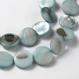 <p>Круглые бусины-пластинки из натурального тонированного перламутра приглушённого зеленовато-сине-голубого цвета. На бусинах есть темные пятна, возможны щербинки естественного происхождения. Бусины могут немного отличаться по форме и размеру. Оттенок может отличаться от фотографии и от партии к партии. Цена за 1 низку длиной около 36 см (примерно 25 бусин, низки формируются без проверки каждой бусины на дефекты).</p>