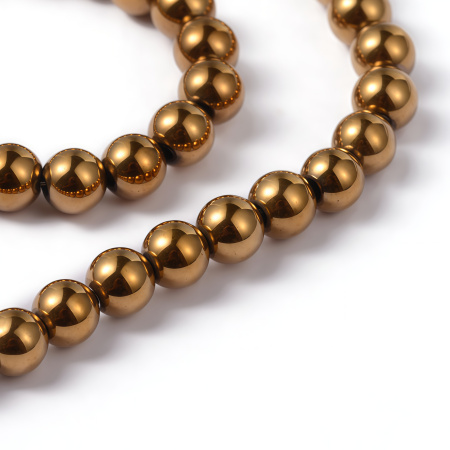 <p>Низка бусин из окрашенного (металлизированного) гематита, цвет золотистый. Бусины могут немного отличаться по форме и размеру. Оттенок может отличаться от фотографии и от партии к партии. Гематит создан искусственно, по составу аналогичен натуральному. В низке около 98 бусин. Низки формируются без проверки каждой бусины на дефекты. Цена за низку.</p>