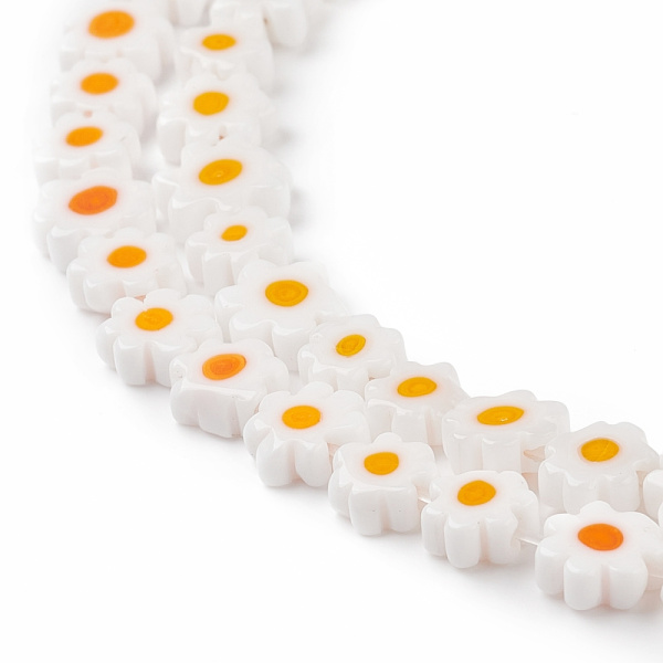 <p>Стеклянные бусины - цветочки ручной работы, выполнены в технике миллефиори (миллефьори). Бусины белого цвета с жёлтой серединкой, напоминают ромашки. У некоторых бусин не хватает лепестков. Оттенок может отличаться от фотографии и от партии к партии. Бусины могут существенно отличаться по форме и размеру. У бусин могут быть скошены лепестки. В низке около 26 бусин, низки формируются без проверки каждой бусины на дефекты. Цена за низку.
</p>