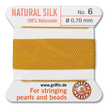 <p>Прочная нить из высококачественного натурального 100% шелка, произведена компанией Griffin (Германия). К нити прикреплена проволочная иголочка. Идеально подходит для использования с жемчугом и натуральными камнями. Цвет темно-желтый (amber). Оттенок может немного отличаться от фотографии. Толщина около 0,7 мм. Цена за моток 2 метра.</p>